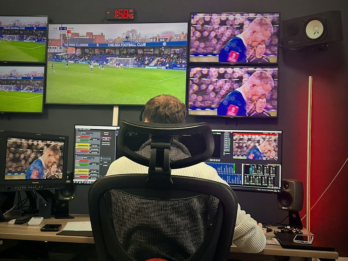 An operator in PCR01 following a live match on the monitor wall.