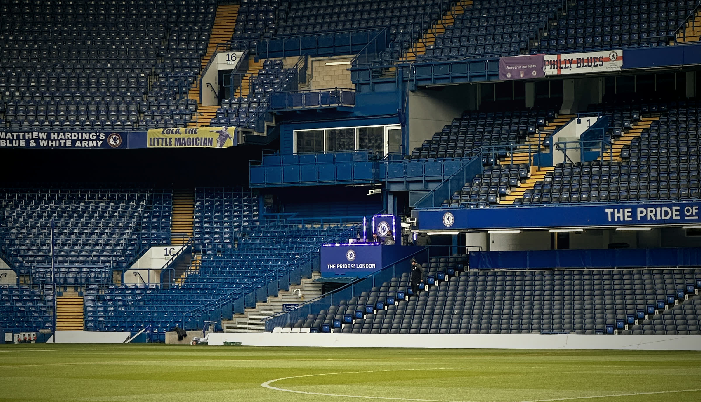 Stamford Bridge before the gates open, with the matchday booth lit up.